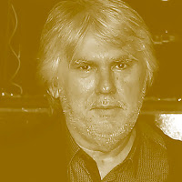 António Victorino d'Almeida: Retrato em tom sépia de um homem de meia-idade com cabelos grisalhos e barba por fazer.