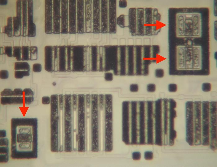 Three bipolar transistors. These transistors transmit the quotient to the rest of
the division circuitry. Three bipolar transistors. These transistors transmit the quotient to the rest of
the division circuitry.