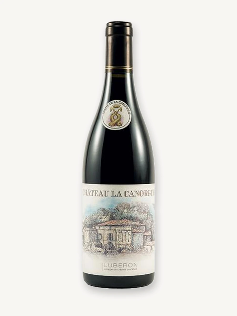 Uma garrafa de vinho tinto Château La Canorgue Luberon com fundo branco.