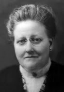 Amy Lowell: Retrato antigo em preto e branco de uma mulher de óculos com cabelo preso.