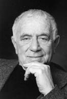 Norman Mailer: Retrato em preto e branco de um homem idoso com a mão no queixo.