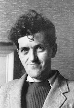 Ludwig Wittgenstein: Retrato em preto e branco de um homem com cabelo cacheado e paletó.
