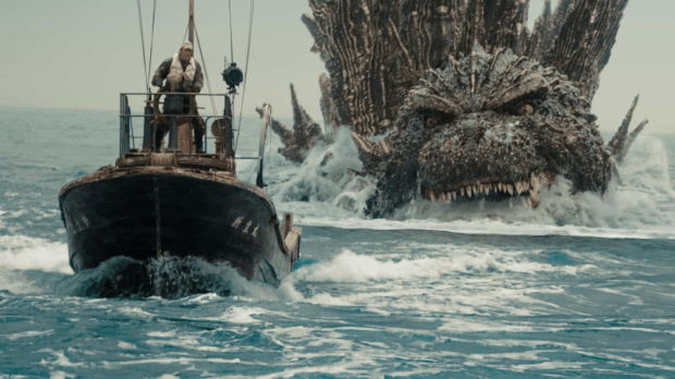 Godzilla: Cena do filme Godzilla Minus One mostrando um barco sendo perseguido pelo Godzilla no mar.